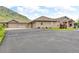 Long driveway leads to the attached garages, providing lots of parking at 5881 Deer Meadow Trl, Golden, CO 80403