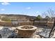 Cozy outdoor fire pit with comfortable seating, perfect for relaxing and entertaining with scenic mountain views at 5881 Deer Meadow Trl, Golden, CO 80403