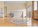 Spacious foyer with hardwood floors, staircase and elegant tile design adding a touch of sophistication and style at 5881 Deer Meadow Trl, Golden, CO 80403