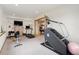 Home gym featuring exercise equipment and a TV, perfect for staying active and healthy at 5881 Deer Meadow Trl, Golden, CO 80403