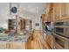 Beautiful kitchen featuring granite countertops, stainless steel appliances, custom cabinetry and large island at 5881 Deer Meadow Trl, Golden, CO 80403