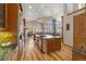 Large kitchen with wood cabinets, granite countertops, stainless appliances, and center island at 5881 Deer Meadow Trl, Golden, CO 80403
