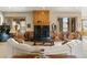 Cozy living room features a fireplace, wood trim, and comfortable seating at 5881 Deer Meadow Trl, Golden, CO 80403