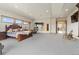 Spacious main bedroom featuring a fireplace, sitting area, and access to the outside at 5881 Deer Meadow Trl, Golden, CO 80403