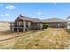 Spacious home featuring a deck and patio ideal for outdoor gatherings and relaxation in a private setting at 5881 Deer Meadow Trl, Golden, CO 80403