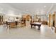 Expansive recreation room with a large bar, billiard table, and comfortable seating at 5881 Deer Meadow Trl, Golden, CO 80403