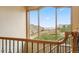 Elegant staircase featuring a large window with scenic views of the surrounding landscape and natural light at 5881 Deer Meadow Trl, Golden, CO 80403
