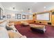 Home theater room featuring a large screen, projector, and comfy seating at 5881 Deer Meadow Trl, Golden, CO 80403