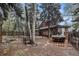 Private backyard retreat with a hot tub and picnic area among mature trees at 10419 Christopher Dr, Conifer, CO 80433