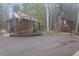 Exterior showing a detached building, trees, and overcast skies creating a sense of seclusion and privacy at 10419 Christopher Dr, Conifer, CO 80433