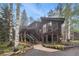 Stunning mountain home with a spacious deck, modern architecture and ample natural light at 10419 Christopher Dr, Conifer, CO 80433