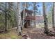 Rustic cabin with a separate greenhouse, balcony, and ample outdoor space at 10419 Christopher Dr, Conifer, CO 80433