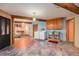 Open laundry area featuring a utility sink and exposed wooden beams at 10419 Christopher Dr, Conifer, CO 80433
