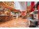 Open floor plan featuring a vintage stove, hardwood floors, a unique island, and an upstairs loft area at 10419 Christopher Dr, Conifer, CO 80433
