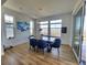 Bright dining area with a stylish table, comfortable blue chairs, and natural light at 8981 Bellsong Circle Cir, Littleton, CO 80125