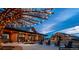 Stunning exterior view of the community house showcasing a stylish outdoor gathering space and modern architecture at 8981 Bellsong Circle Cir, Littleton, CO 80125