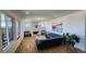 Bright living room featuring a modern fireplace, sleek furniture, and plenty of natural light at 8981 Bellsong Circle Cir, Littleton, CO 80125