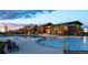 Community pool and clubhouse with chairs and water features at 8981 Bellsong Circle Cir, Littleton, CO 80125