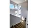 Bright staircase with carpeted steps and large windows offering natural light at 8981 Bellsong Circle Cir, Littleton, CO 80125