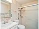 Cozy bathroom featuring a glass door shower and single sink vanity at 9327 W Arizona Ave, Lakewood, CO 80232
