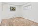 Empty bedroom with neutral walls and carpet, two windows offering natural light at 9327 W Arizona Ave, Lakewood, CO 80232