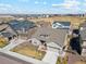 An aerial view of a single-Gathering home boasting a cozy backyard patio and garden at 14160 Ivanhoe St, Thornton, CO 80602