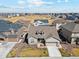 Aerial view of a single-Gathering home in a neighborhood with a well-manicured lawn at 14160 Ivanhoe St, Thornton, CO 80602