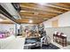 Unfinished basement space ready for customization, featuring exposed beams and ample storage at 14160 Ivanhoe St, Thornton, CO 80602
