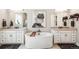 Beautiful bathroom with double vanities, a soaking tub, and modern fixtures at 14160 Ivanhoe St, Thornton, CO 80602