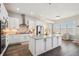 Spacious kitchen with a large island, stainless steel appliances, and sleek hardwood floors at 14160 Ivanhoe St, Thornton, CO 80602