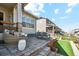 Relaxing backyard patio boasts wicker seating and a paved area at 14160 Ivanhoe St, Thornton, CO 80602