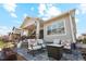 Charming patio features comfortable seating and gas fire pit for entertaining at 14160 Ivanhoe St, Thornton, CO 80602