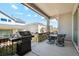 Covered patio features outdoor dining, a built-in grill, and great views at 14160 Ivanhoe St, Thornton, CO 80602