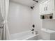 Clean white bathroom with tiled shower, white cabinets, and modern fixtures at 2880 S Locust St # 305N, Denver, CO 80222