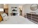 Neutral bedroom featuring a desk area, stylish decor, and an ensuite bathroom at 2880 S Locust St # 305N, Denver, CO 80222