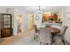 Dining area featuring a table with four chairs, connecting the living spaces and kitchen at 2880 S Locust St # 305N, Denver, CO 80222
