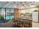 Convenient kitchenette adjacent to the pool area, featuring modern appliances and seating at 2880 S Locust St # 305N, Denver, CO 80222