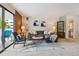 Inviting living room features a comfortable gray sectional, stylish decor, and access to a private balcony at 2880 S Locust St # 305N, Denver, CO 80222