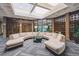 Inviting lobby area with a unique seating arrangement, glass table, and stylish decor at 2880 S Locust St # 305N, Denver, CO 80222