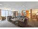 Comfortable lounge area with modern furniture and an open layout connecting to a kitchenette at 2880 S Locust St # 305N, Denver, CO 80222