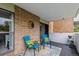 Outdoor patio with seating, brick wall, and a view at 2880 S Locust St # 305N, Denver, CO 80222