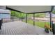 Relaxing covered back deck with lovely views of the lawn and garden at 2843 S Otis St, Denver, CO 80227