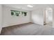 Bedroom with gray carpet, white walls, and a window with a view of the outdoors at 2843 S Otis St, Denver, CO 80227