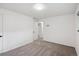 Comfortable carpeted bedroom showcasing neutral walls and standard door frame at 2843 S Otis St, Denver, CO 80227