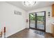 Bright dining area with sliding glass doors leading to an outdoor deck or patio at 2843 S Otis St, Denver, CO 80227