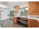 Bright kitchen features wood cabinets, countertops, wood floors, and sliding doors to outdoor space at 2843 S Otis St, Denver, CO 80227
