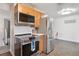 Kitchen featuring stainless steel appliances and a breakfast nook with seating at 2843 S Otis St, Denver, CO 80227