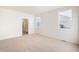 Bright and open primary bedroom featuring a walk-in closet and ensuite bathroom at 27674 E Byers Ave, Aurora, CO 80018