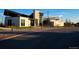 Exterior shot of modern clubhouse with stone accents, well-maintained landscaping, and ample parking at 27674 E Byers Ave, Aurora, CO 80018