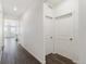 Bright hallway features modern lighting and leads to the kitchen, enhancing the home's contemporary appeal at 27674 E Byers Ave, Aurora, CO 80018